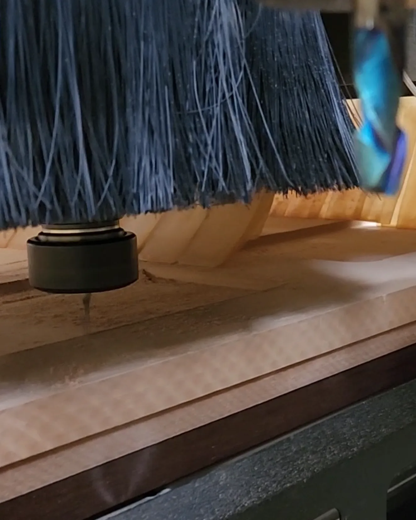 CNC machine routing a one-piece HDF cabinet door profile
